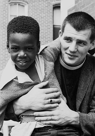Minister and boy in front of Brown Chapel  A.M.E. Church
