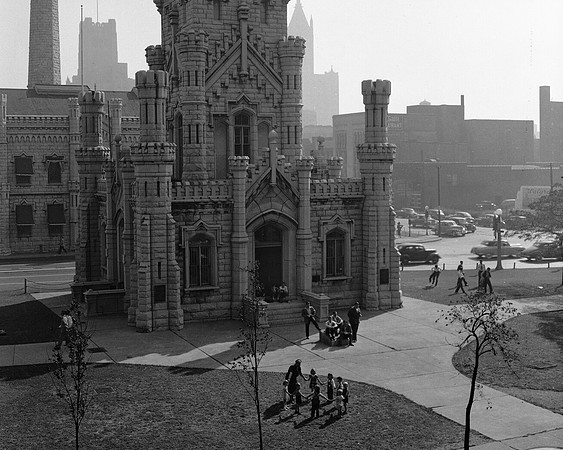 Children play in front of the Chicago Water Towe (ST-17500931)