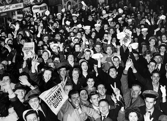 Crowd celebrates news of Nazi surrender during World War II (ST-17500592)