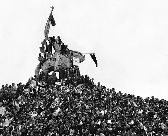 Vietnam War protesters flock around the Logan Statue (ST-17500716)