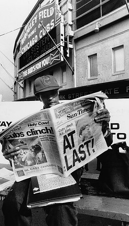 Cubs fan reading newspaper after the Cubs clinched the NL East (ST-17500901)